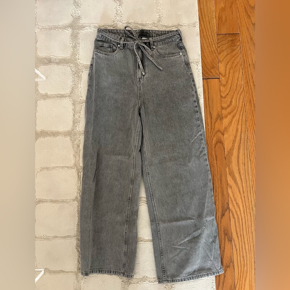 Grey baggy jeans with tie belt